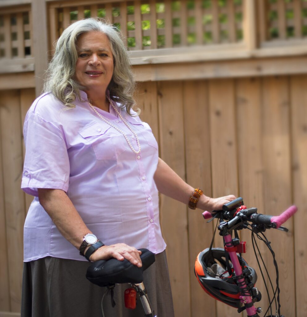 Jennifer Pritzker bio personal photo of her with her bike.